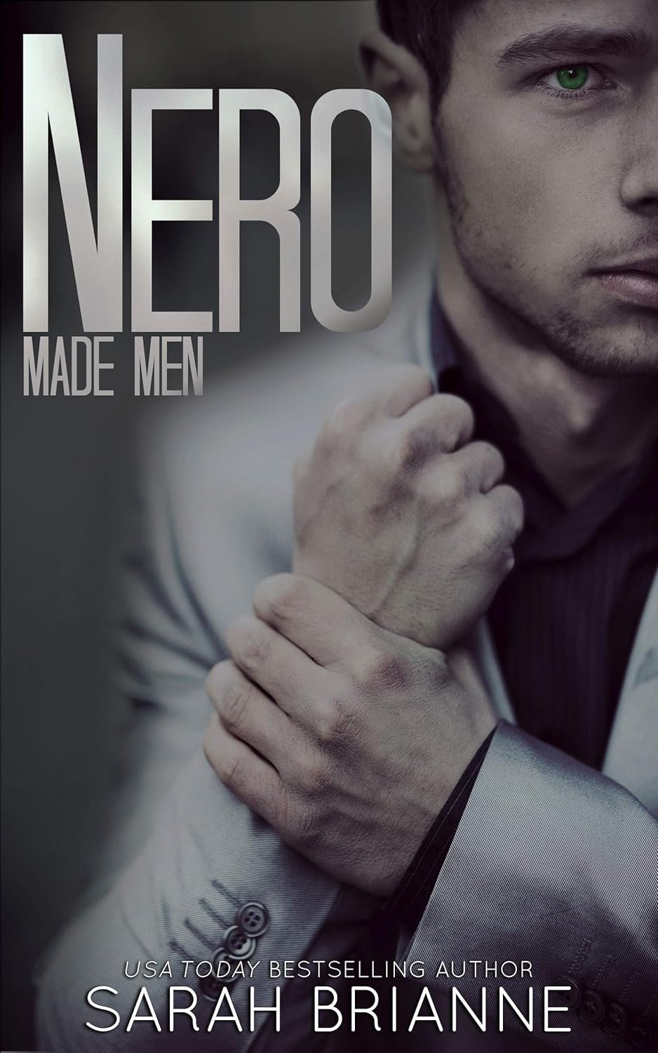 nero made men book cover with mafia man holding wrist in mafia romance novel